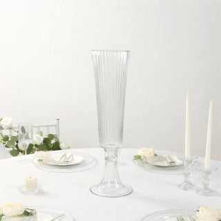 Elegant tall glass vase with ribbed design for floral arrangements