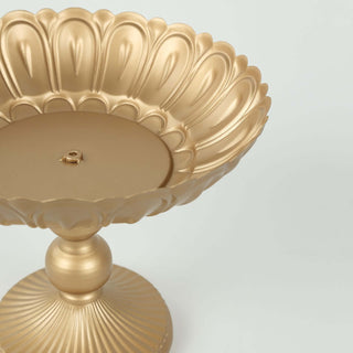 Gold decorative pedestal dish with intricate scalloped design.