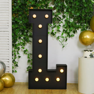 Large illuminated letter 'L' decor with bulbs, perfect for events and celebrations.