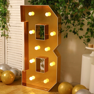 Gold marquee letter B with lights, perfect for celebrations and events.