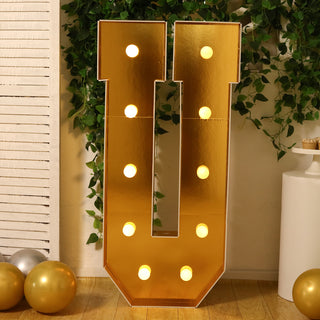 Gold marquee letter 'U' with lights, perfect for events and celebrations.