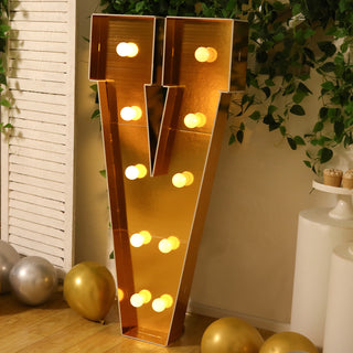 Gold marquee letter "V" with lights, perfect for events and celebrations.