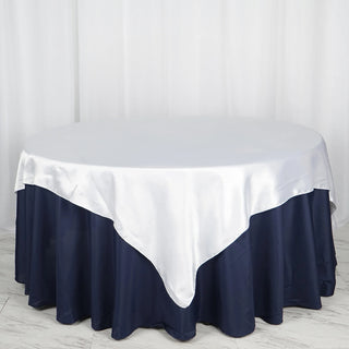 Create an Enchanting Atmosphere with the 72x72 White Seamless Satin Square Tablecloth Overlay