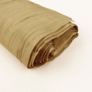 Rolled tan fabric with textured finish on a plain background