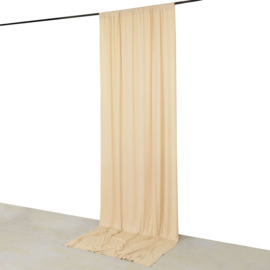 Beige fabric backdrop draped from a rod, ideal for photo shoots.
