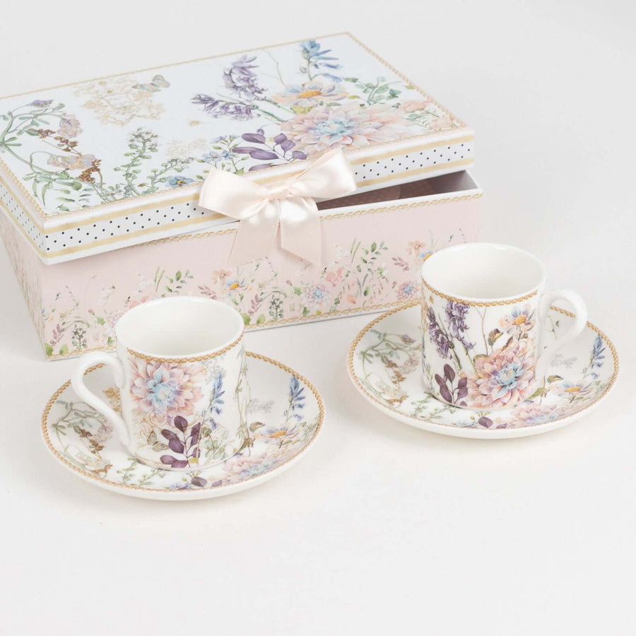 Floral porcelain teacups with saucers and decorative gift box