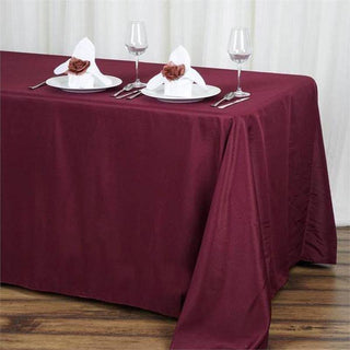 Elevate Your Event Decor with the 90x132 Burgundy Seamless Polyester Rectangular Tablecloth