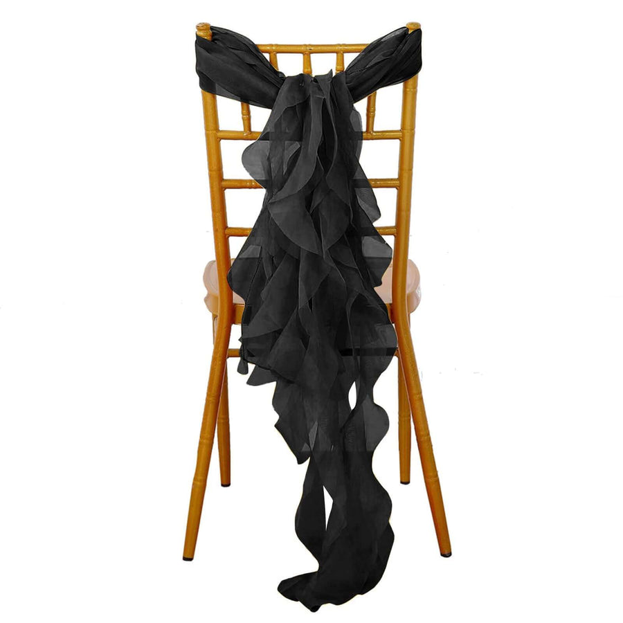 Black ruffled chair sash draped elegantly on a wooden chair