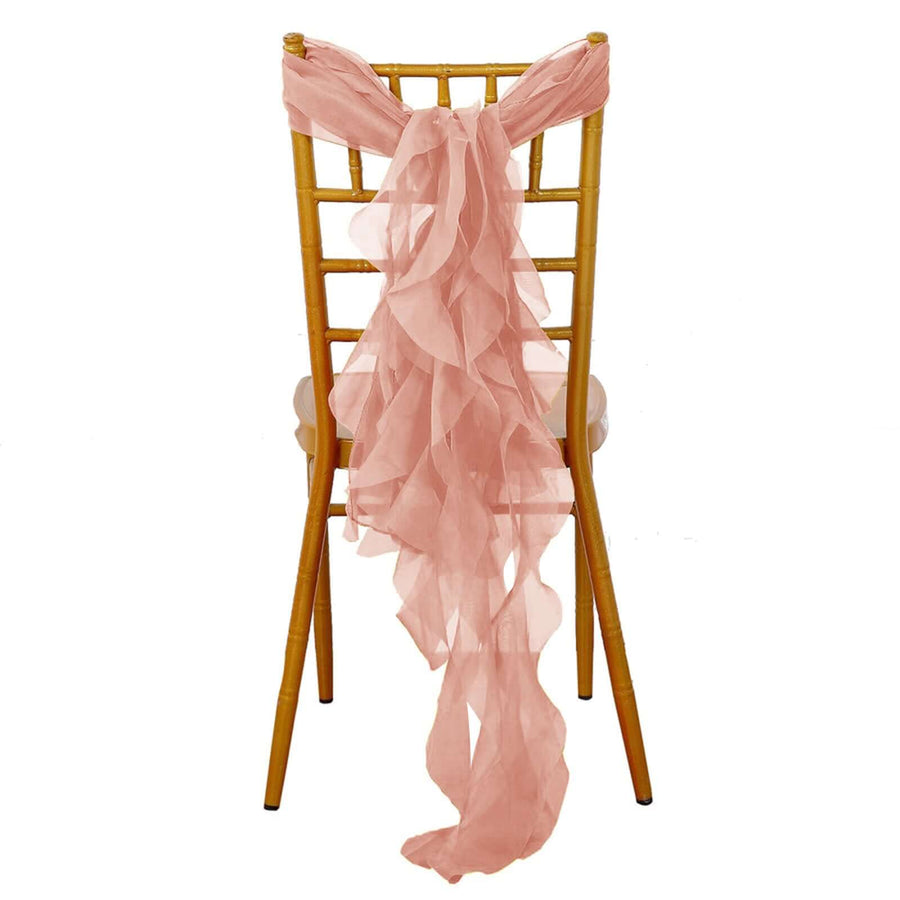 Pink chiffon chair sash tied on a gold chiavari chair.