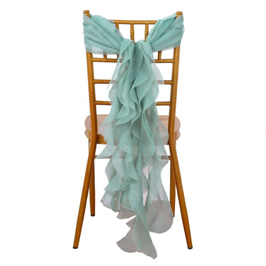 Aqua chiffon chair sash draped elegantly on a bamboo chair.