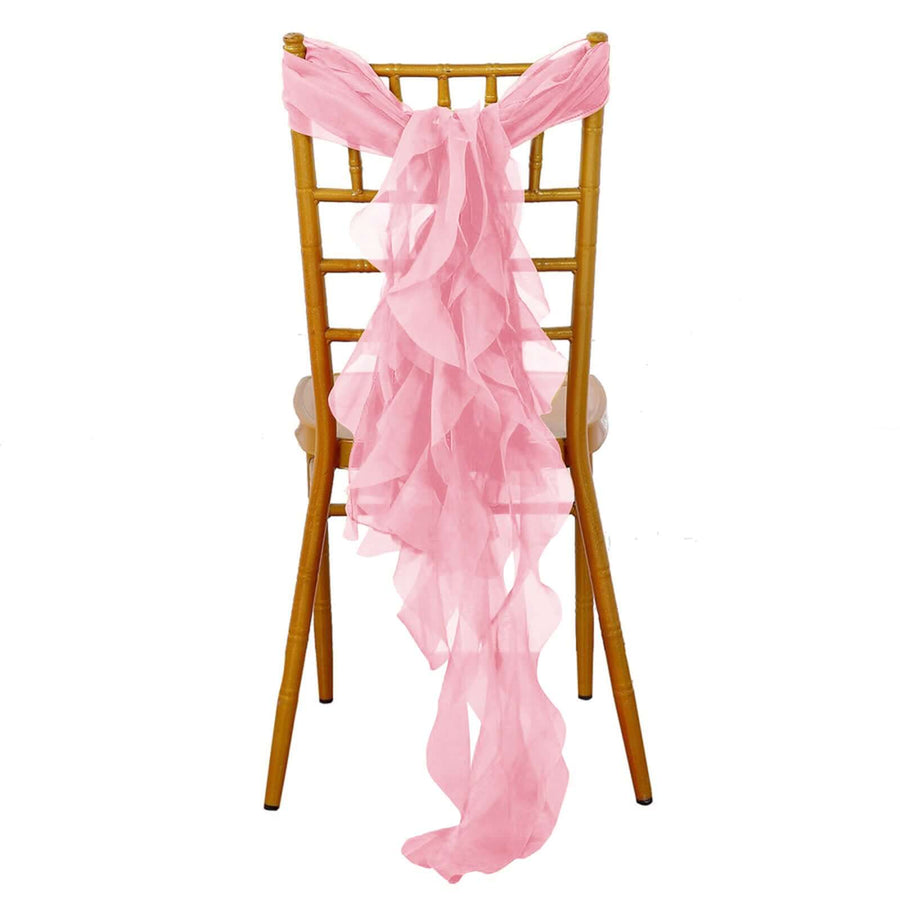 Pink chiffon chair sash draped elegantly on a gold chiavari chair.