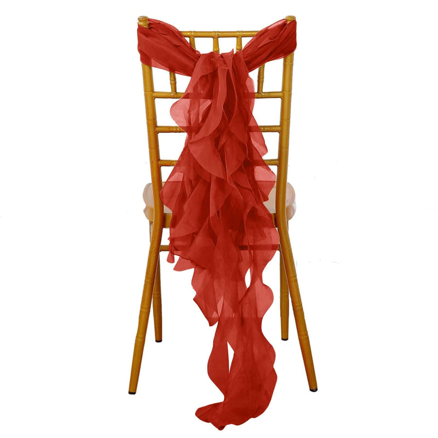 Red chiffon chair sash draped on a golden Chiavari chair