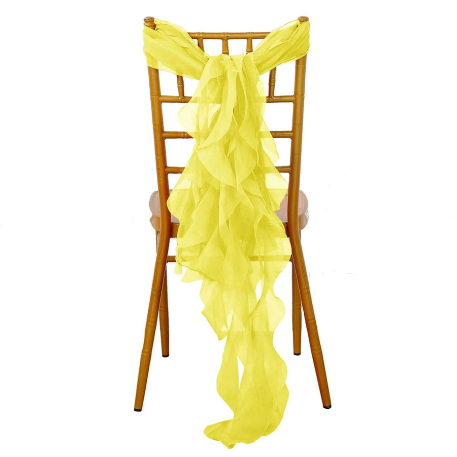 Yellow chiffon chair sash draped elegantly on a wooden chair