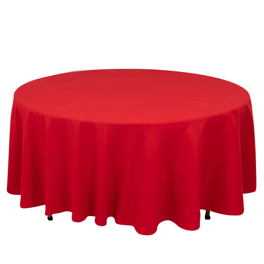 Red round tablecloth with elegant draping.