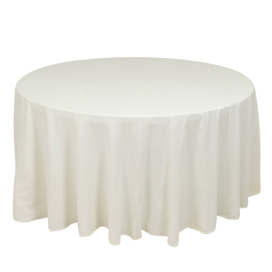 Round white tablecloth draped elegantly over a table.