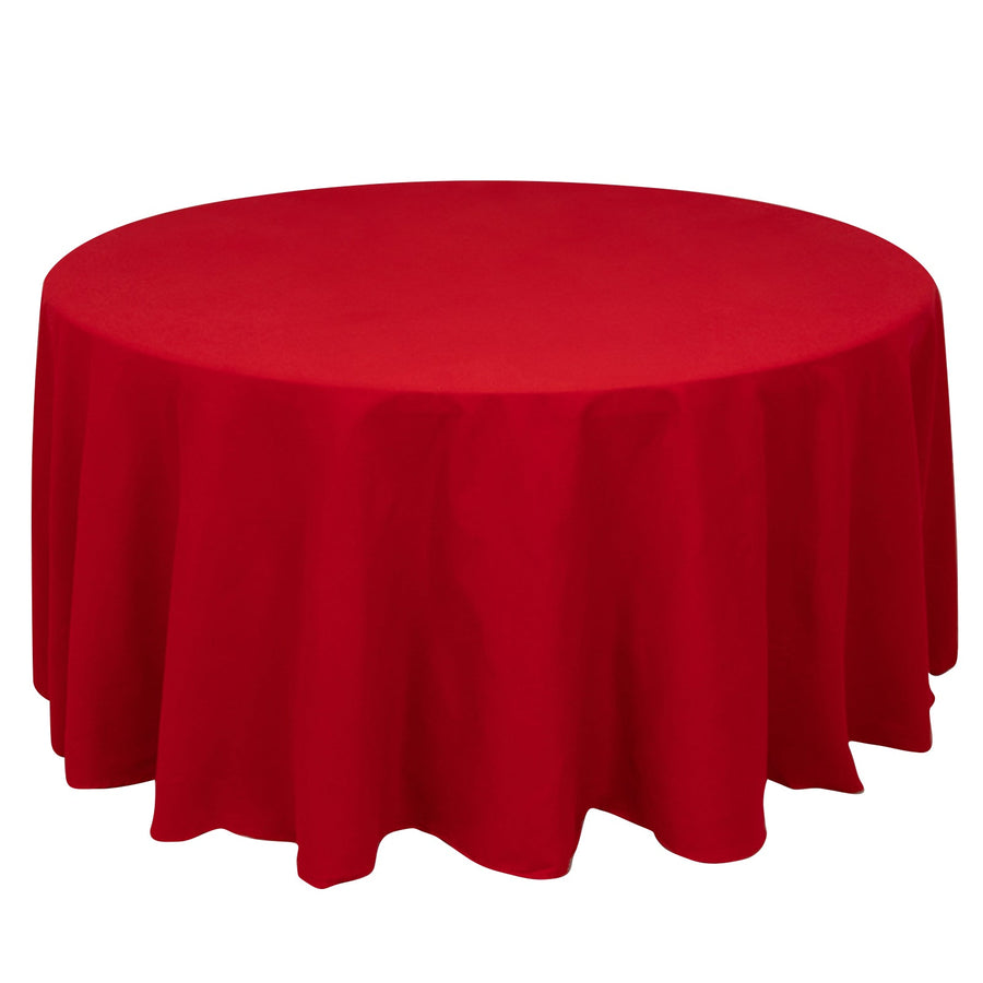 Red round tablecloth draped elegantly over a circular table.