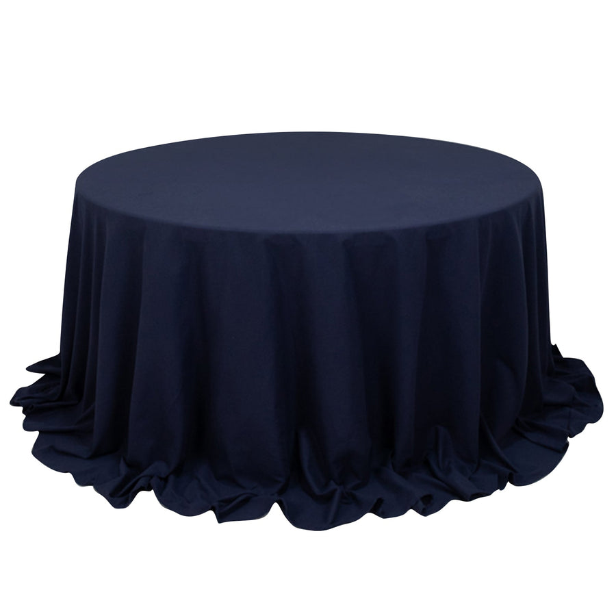 Round navy tablecloth with elegant draping.