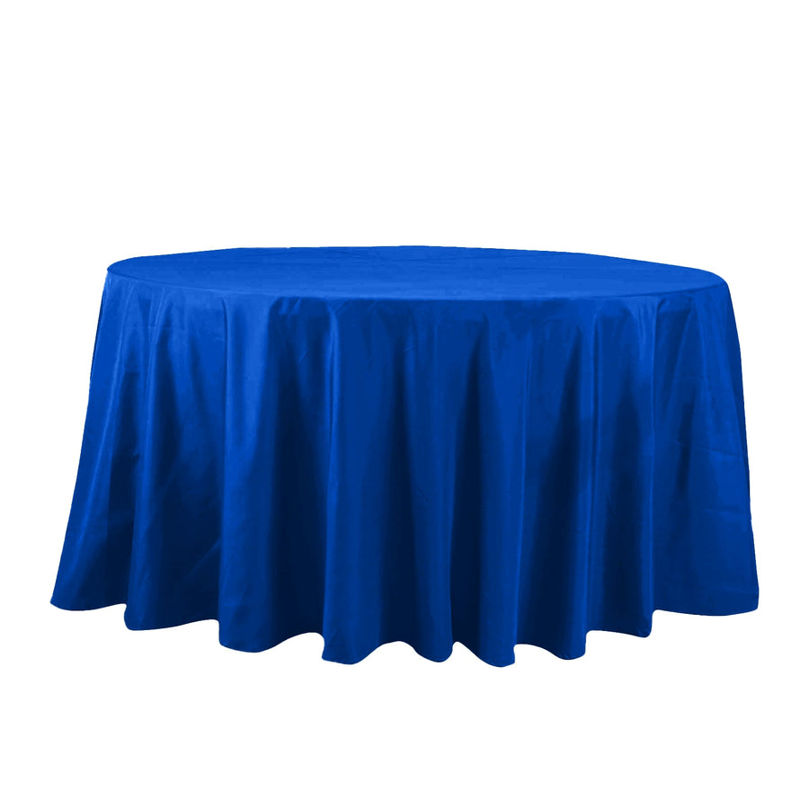 Round blue tablecloth on a plain backdrop