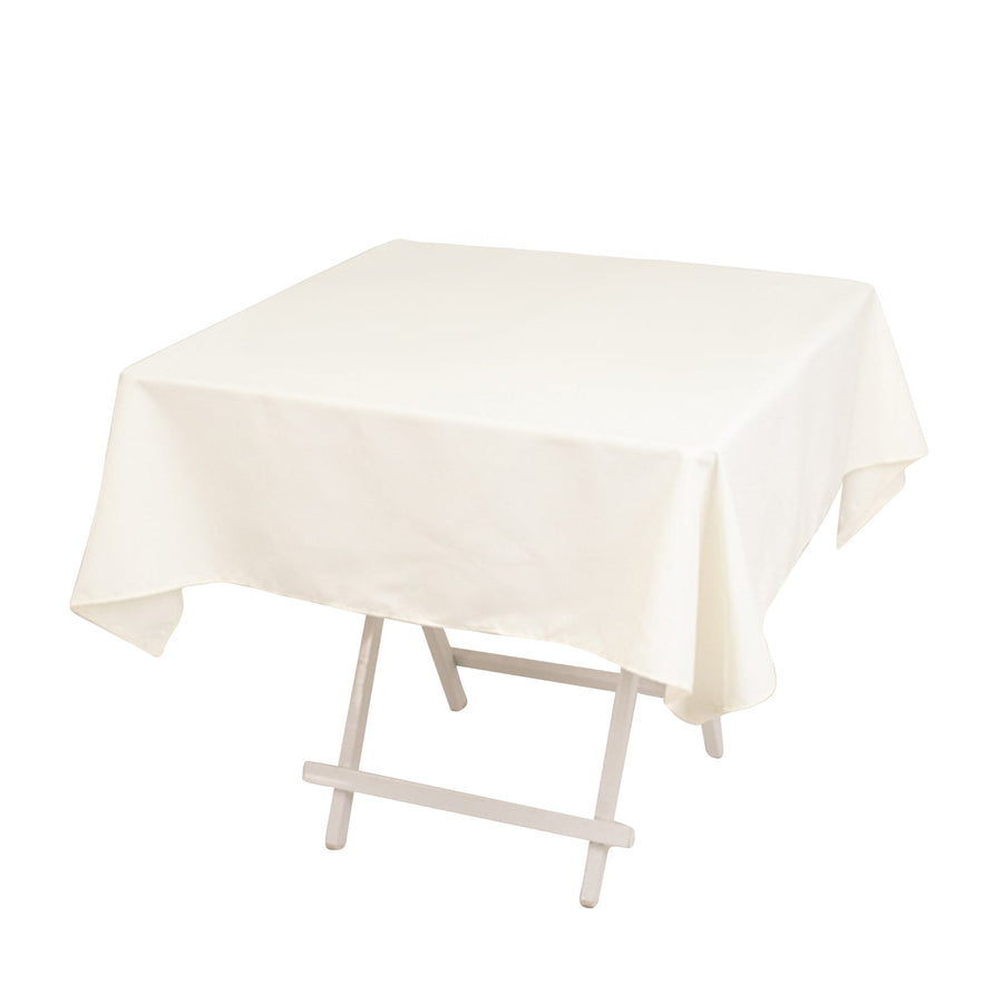 White tablecloth draped over a folding table