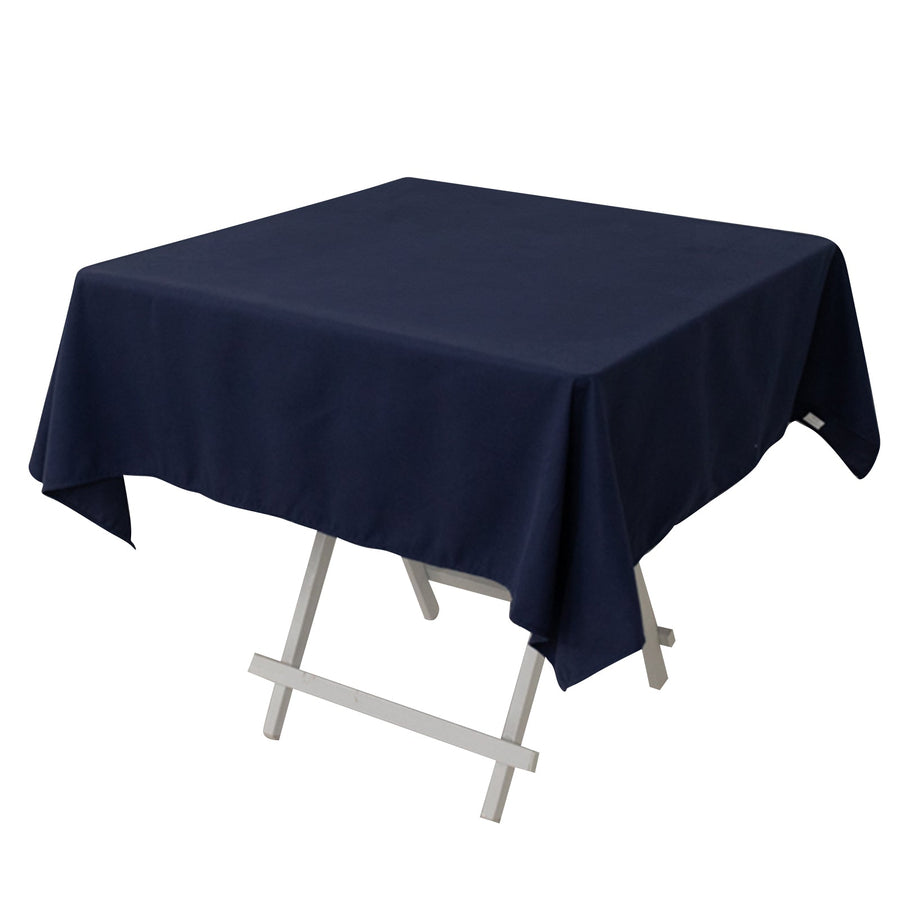 Navy blue tablecloth draped over a folding table