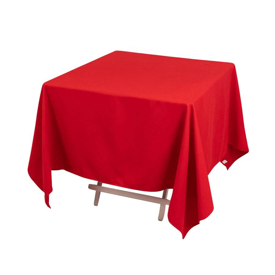 Red square tablecloth on a wooden table
