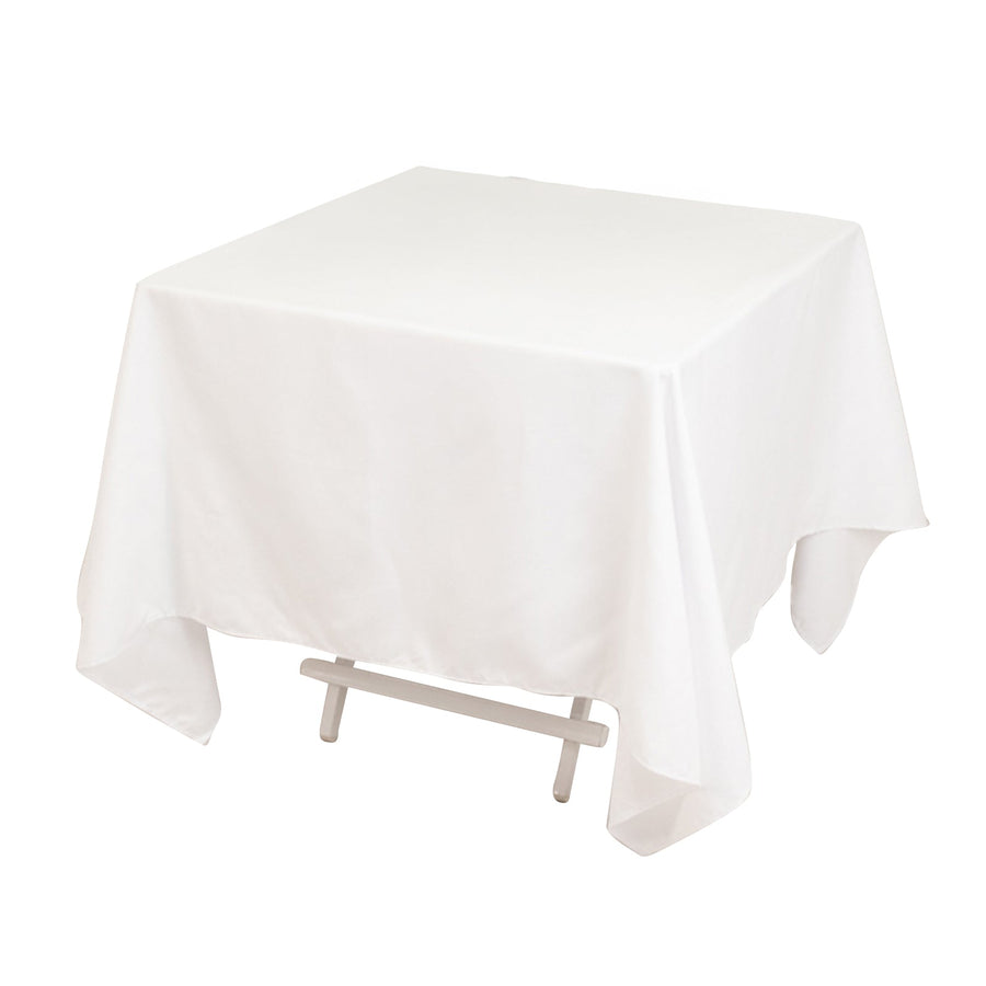 White tablecloth draped over a table, showcasing its full shape.