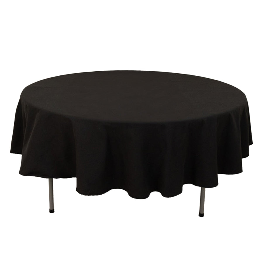 Round black tablecloth draped over a circular table