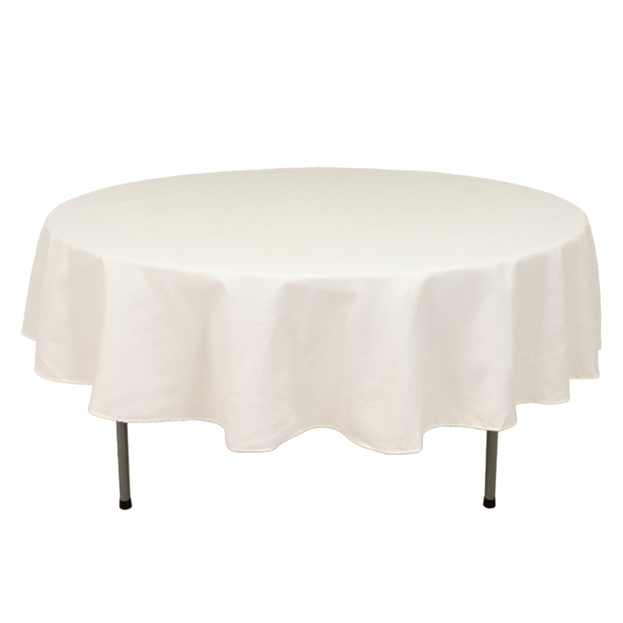 White round table with a smooth tablecloth, showcasing a clean design.