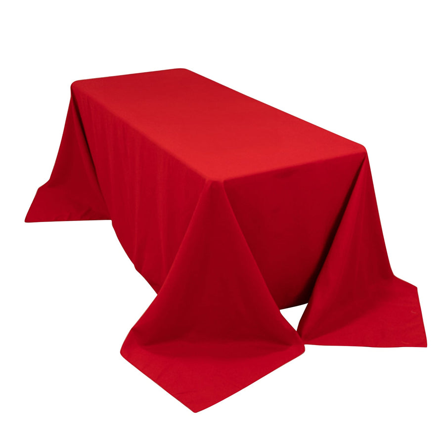 Red tablecloth draped on a rectangular table