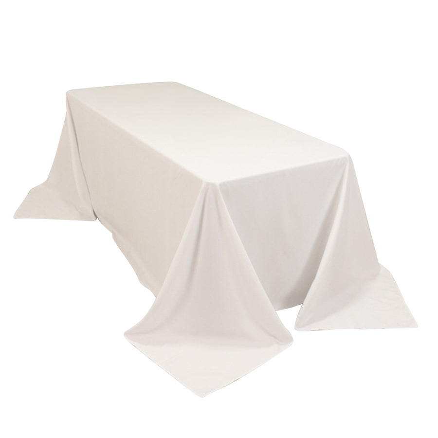 White rectangular tablecloth draping over a table