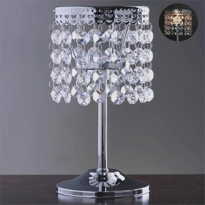 Crystal beaded table lamp with chrome base and elegant design.