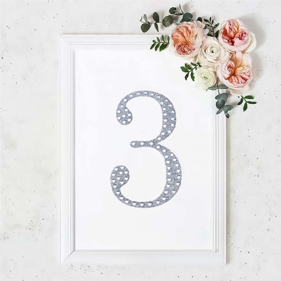 Decorative framed number three with floral accents.