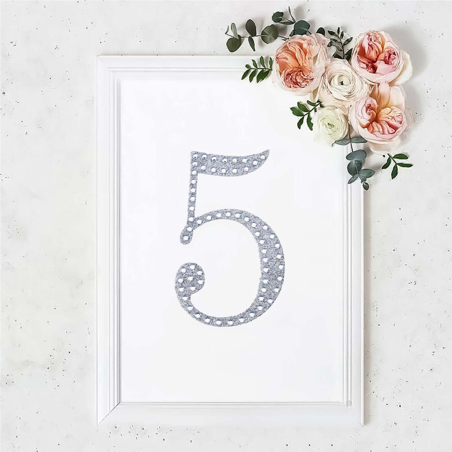 Decorative wall art featuring the number 5 with floral accents