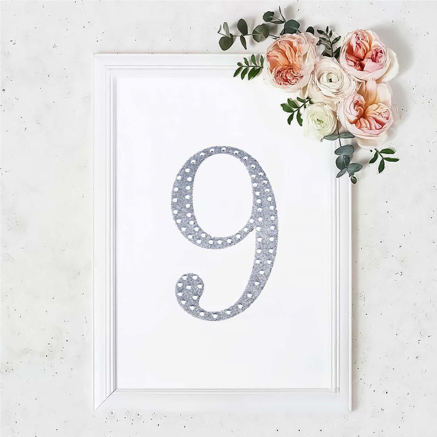 Decorative framed print of the number 9 with floral accents.