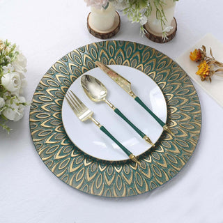 Elegant dinnerware set with decorative plate and gold-accented cutlery.