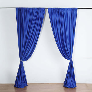 Blue drapery curtains elegantly styled in a studio shot.