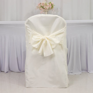 White chair cover with bow tie detail, ideal for events and weddings.