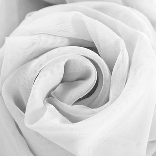 White sheer fabric in a delicate, swirling rose shape.
