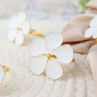 Elevate Your Table with White and Gold Metal Flower Napkin Rings Elevate Your Table with White and Gold Metal Flower Napkin Rings
