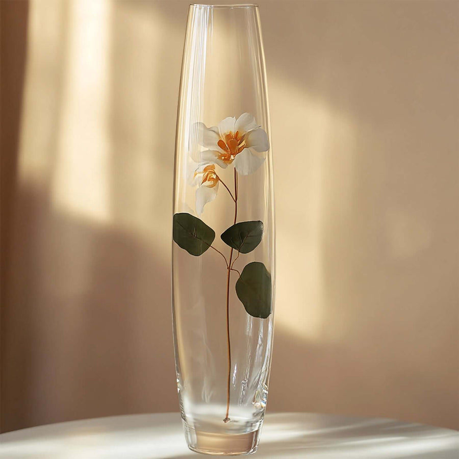 Elegant glass vase with a flower and leaves design.