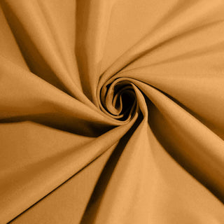 Textured golden fabric in a swirling pattern. #whtbkgd