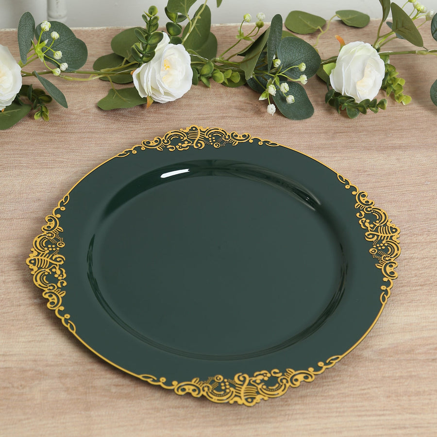 Green decorative plate with gold trim on a wooden surface.