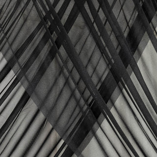 Abstract black and gray fabric texture with layered lines and patterns. #whtbkgd