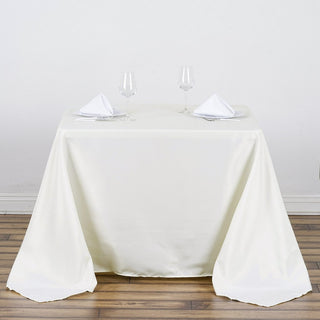 Elegant Ivory Square Polyester Tablecloth - Perfect for Sophisticated Events Elegant Ivory Square Polyester Tablecloth - Perfect for Sophisticated Events