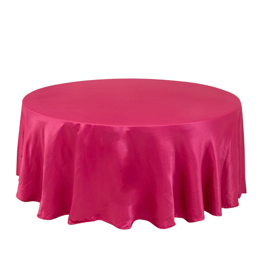 Round pink tablecloth on a plain background