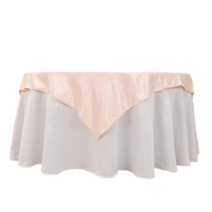 Pink satin overlay on white tablecloth