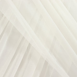 White sheer fabric draped in soft layers for elegant design. #whtbkgd