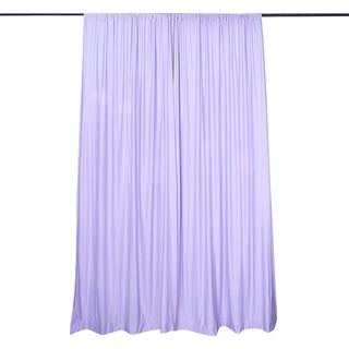 Purple curtain panel draped on a rod, showcasing elegant pleats.