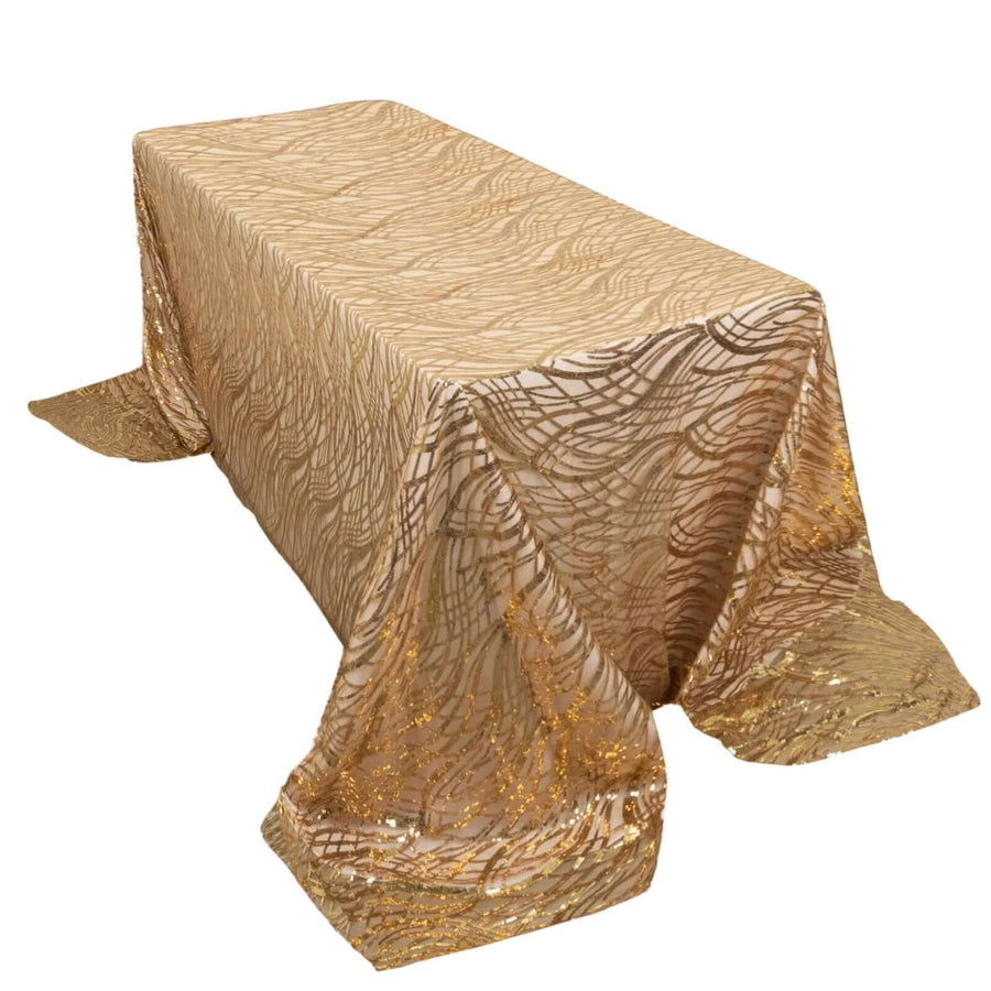 Gold patterned tablecloth with shimmering accents on a rectangular table.