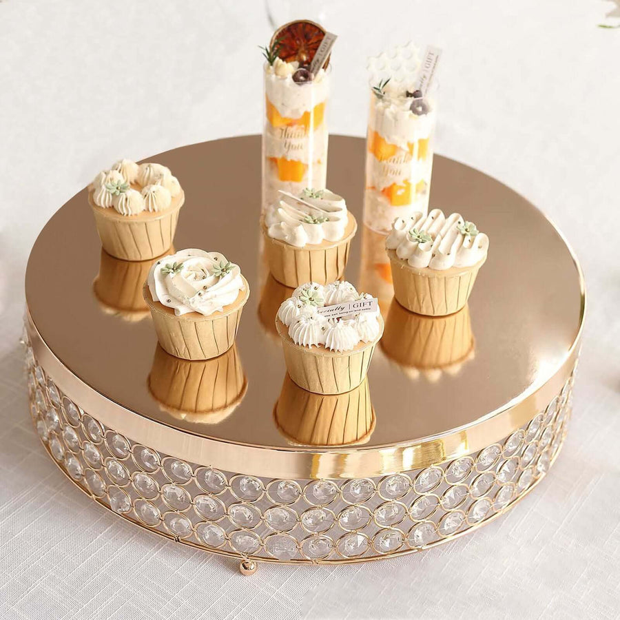 Elegant dessert display with mini cupcakes and parfaits on a decorative cake stand.